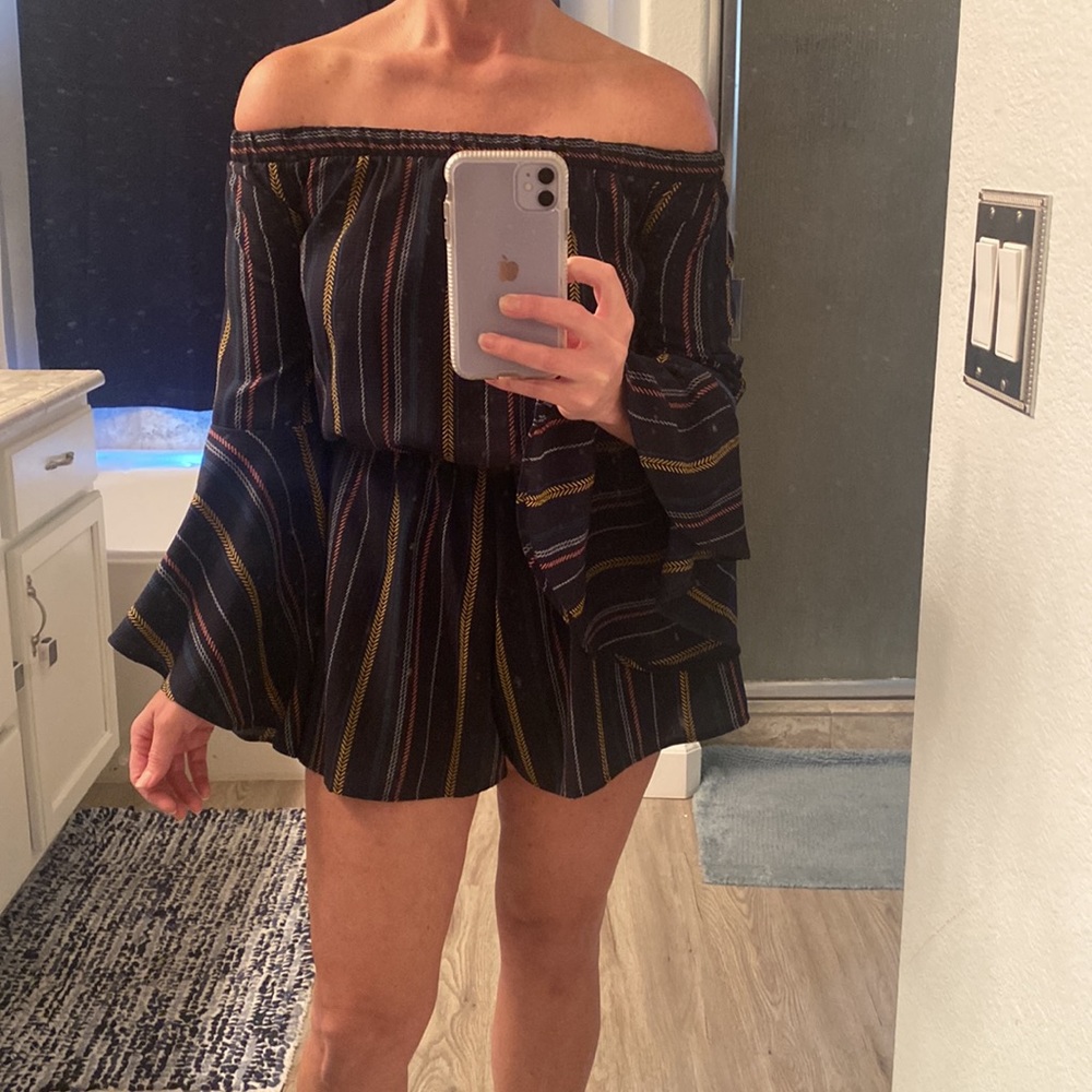 Long sleeved off-shoulder romper.